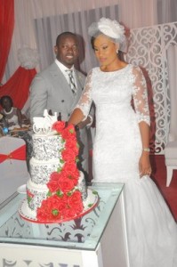 Couple cutting their wedding cake
