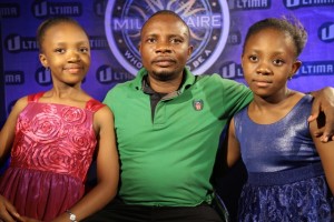 MR PAUL OWANGA (father) with daughters 