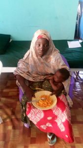 Amina Ali Nkek with her baby